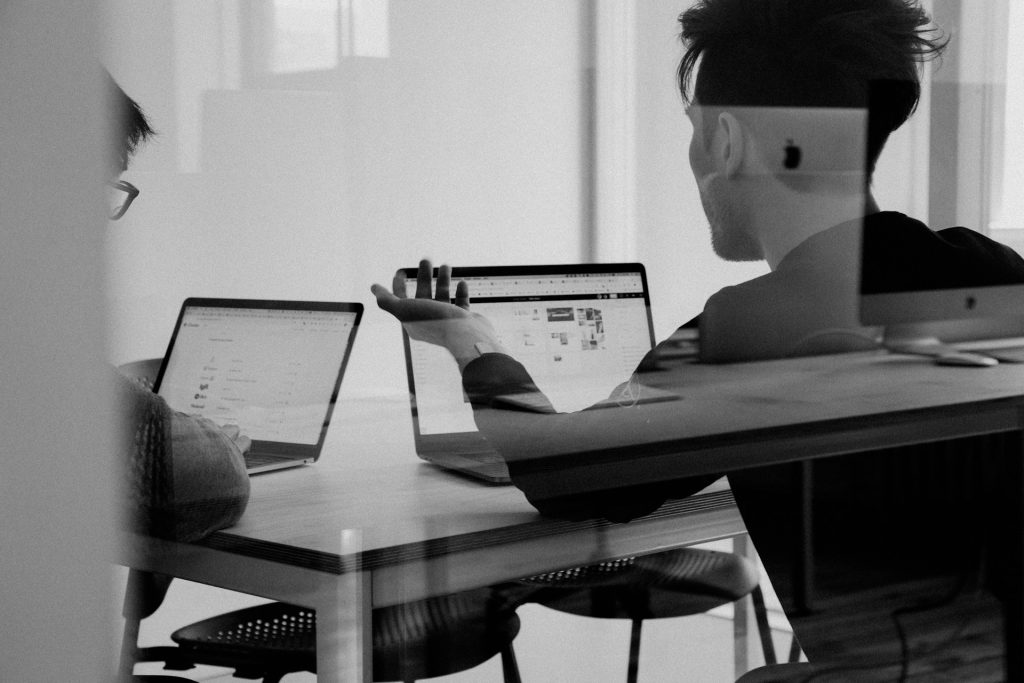 Two Guys at Desk